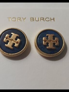 Tory Burch Kira semiprecious stud earrings feature a navy blue lapis stone.